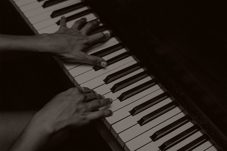 close up of person playing piano